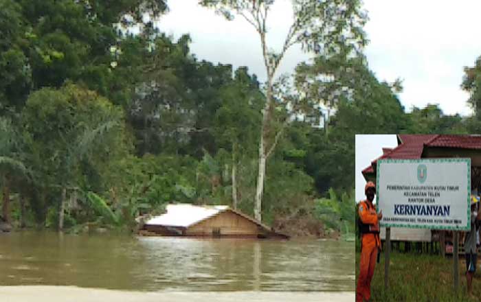 Sebuah rumah di Desa Kernyanyan, Kecamatan Telen, kutai timur yang dilanda banjir hanya terlihat bagian atap.